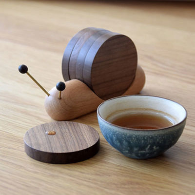 黒ナッツコースター クリエイティブ スナイルデザイン 木製保温カップ プレイス 現代のスタイル